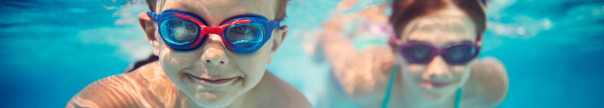 boy and girl swimming in pool